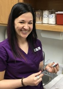 Assistant preparing a vaccine