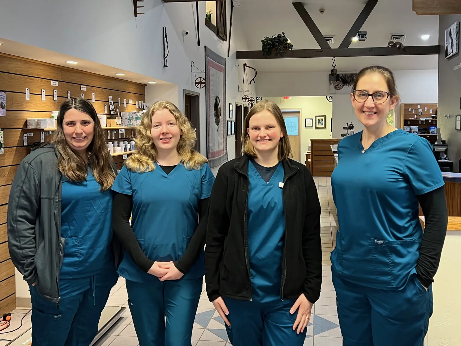 Four Countrycare team members standing together at the front desk