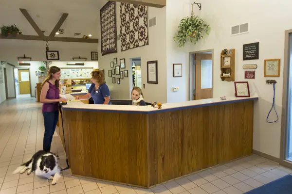 The reception area, with its beamed ceiling and quilts on the walls