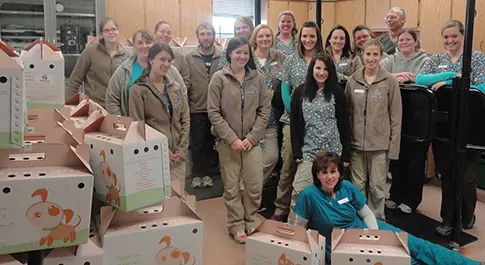 The Countrycare team with a stack of pet carriers